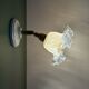 Vintage tulip glass wall light in transparent, slightly pearlescent white.