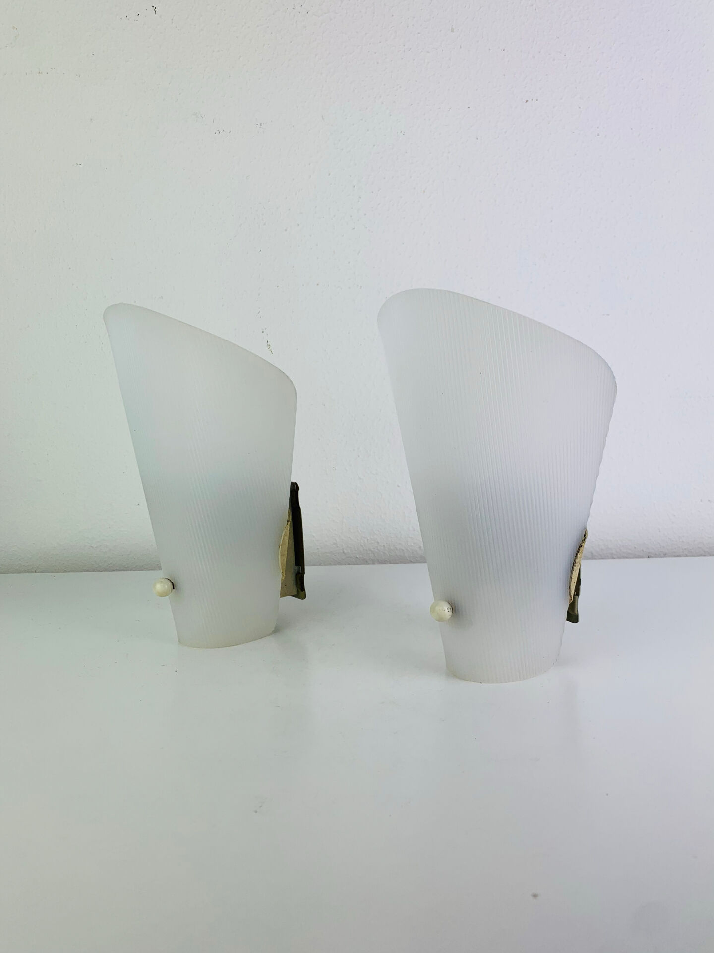 Pair of 1950s striped plastic wall lights.