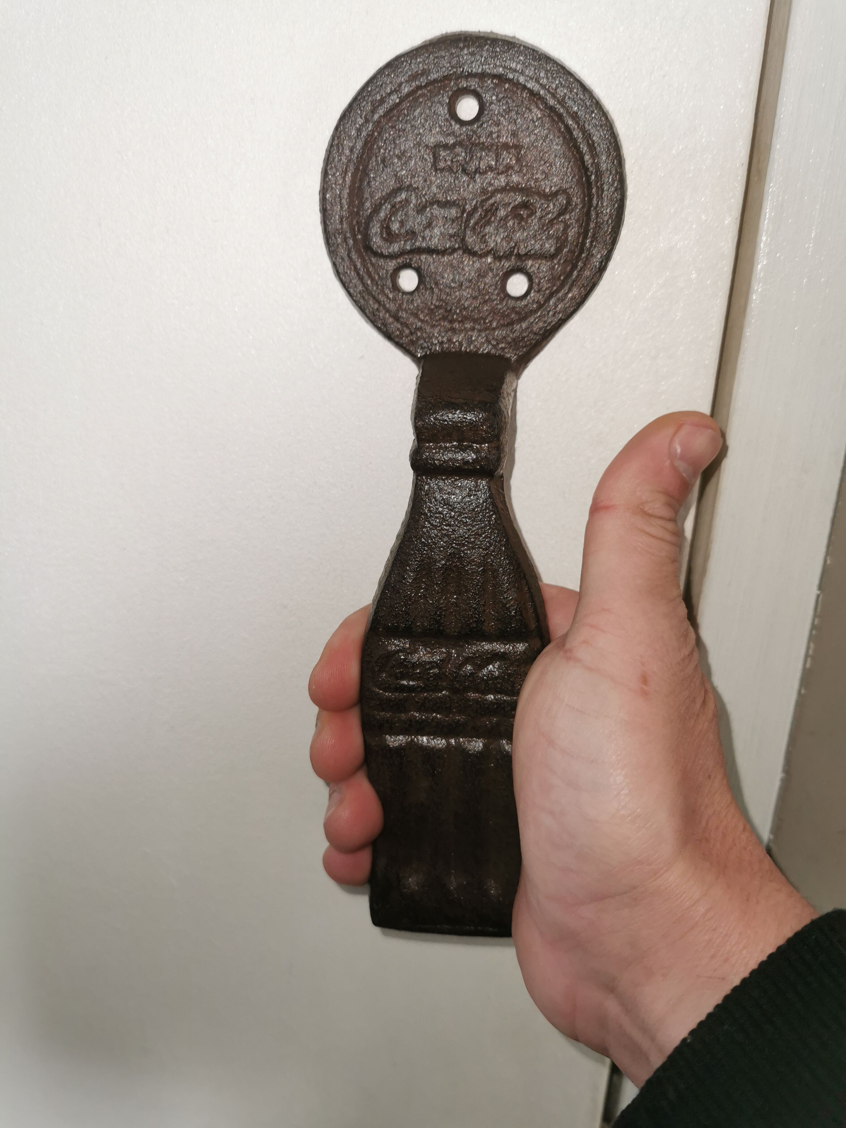 Cast-and-white coca cola door handles