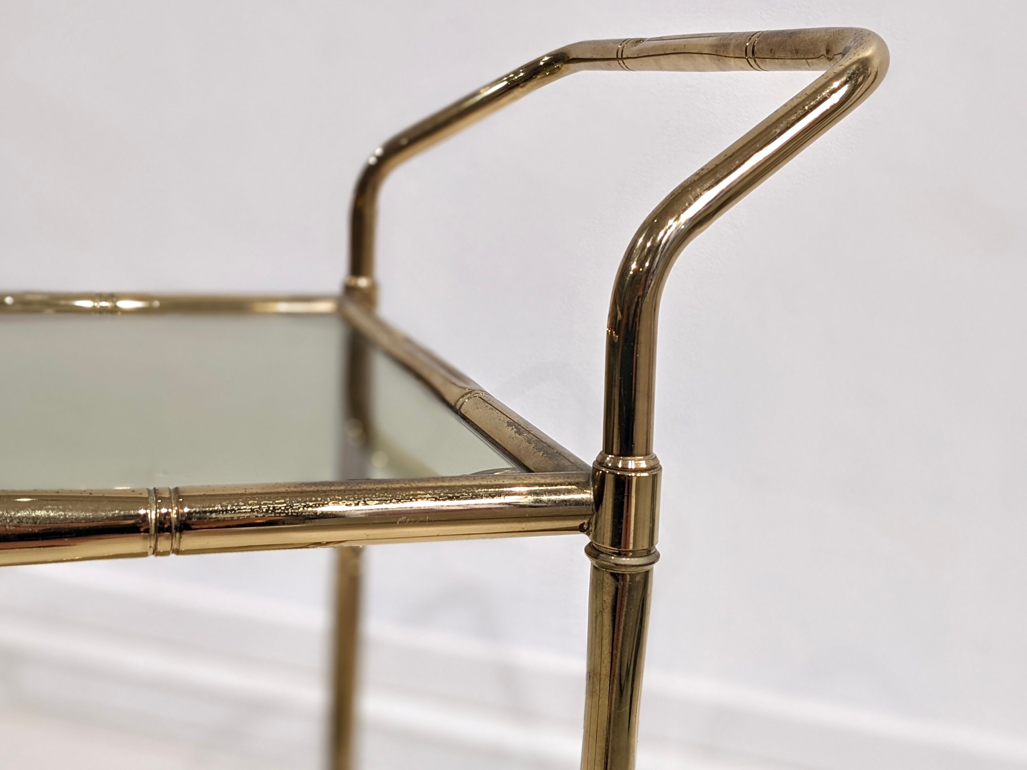 Golden metal dessert with tinted glass tops