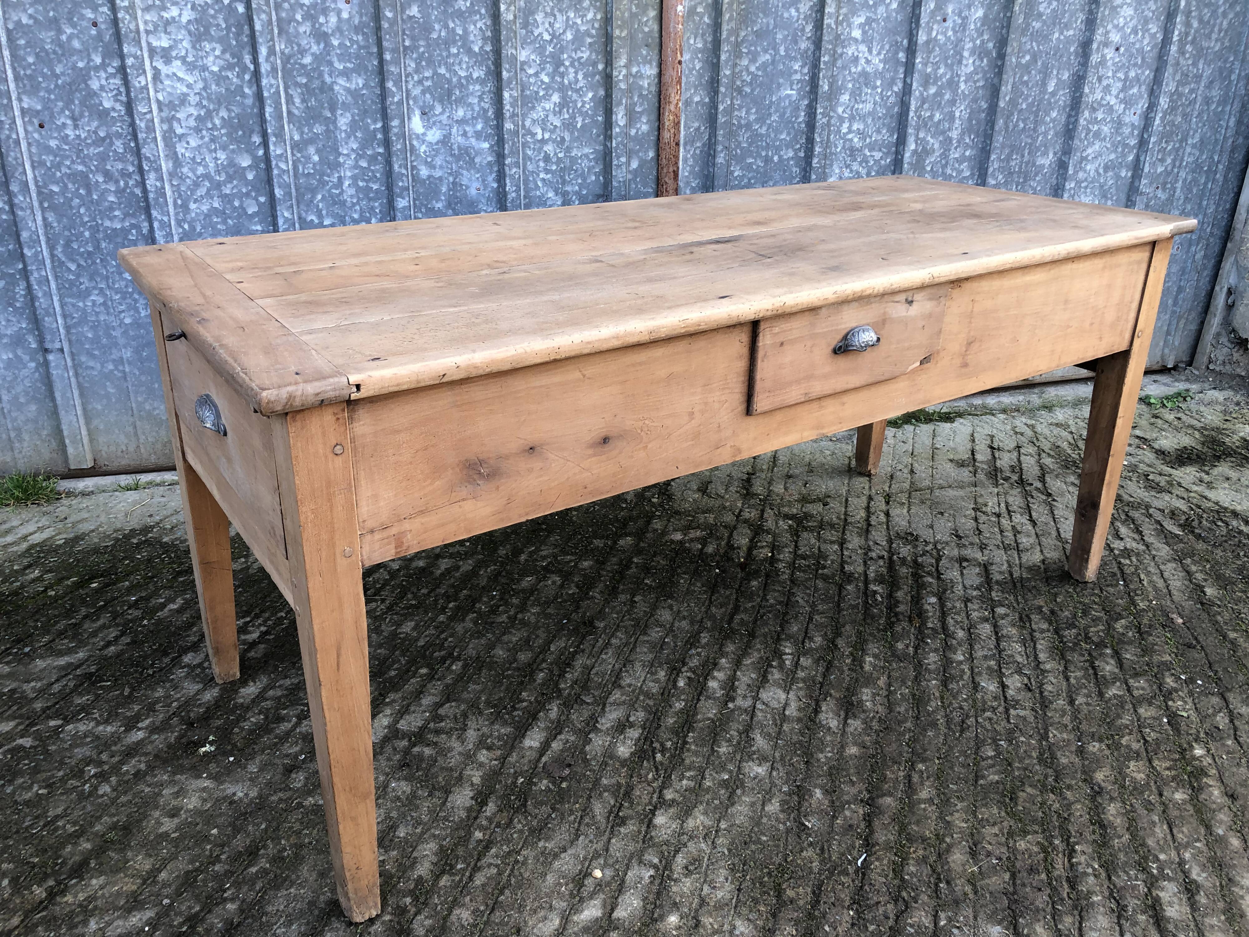 Antique solid cherry farmhouse table with 3 drawers and 1 pull out.