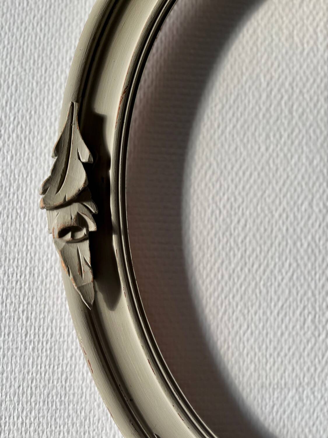 Oval frame in weathered wood