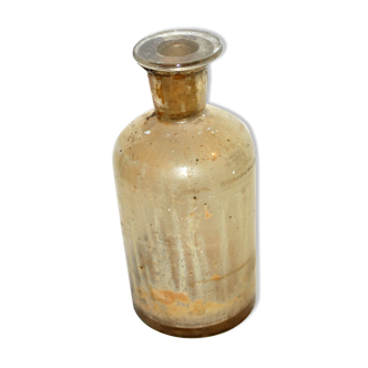 Old apothecary bottle made of bleached glass - pharmacy bottle