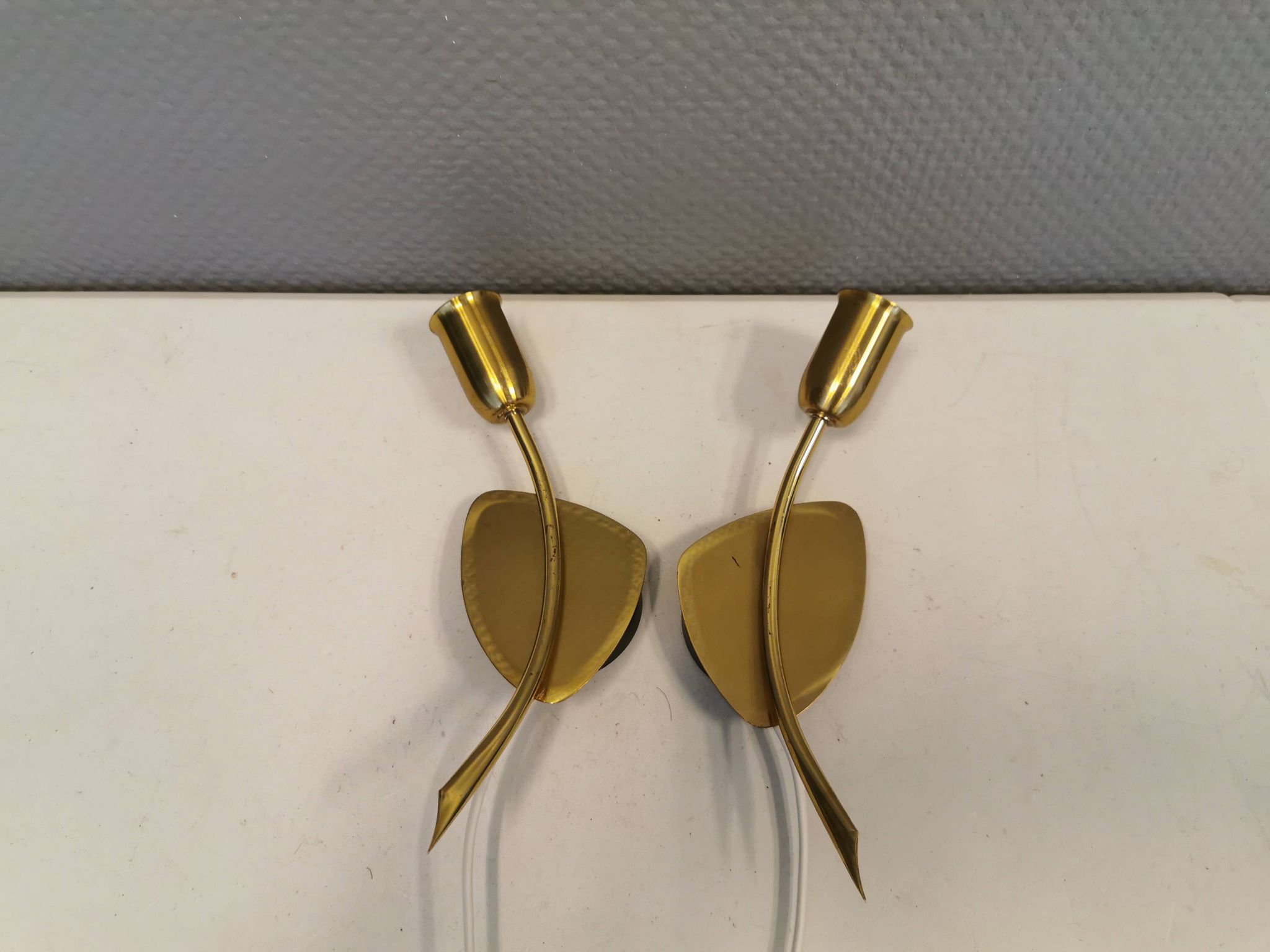 A set of "tulip" wall lamps in golden colored metal. Danish 1970-80s