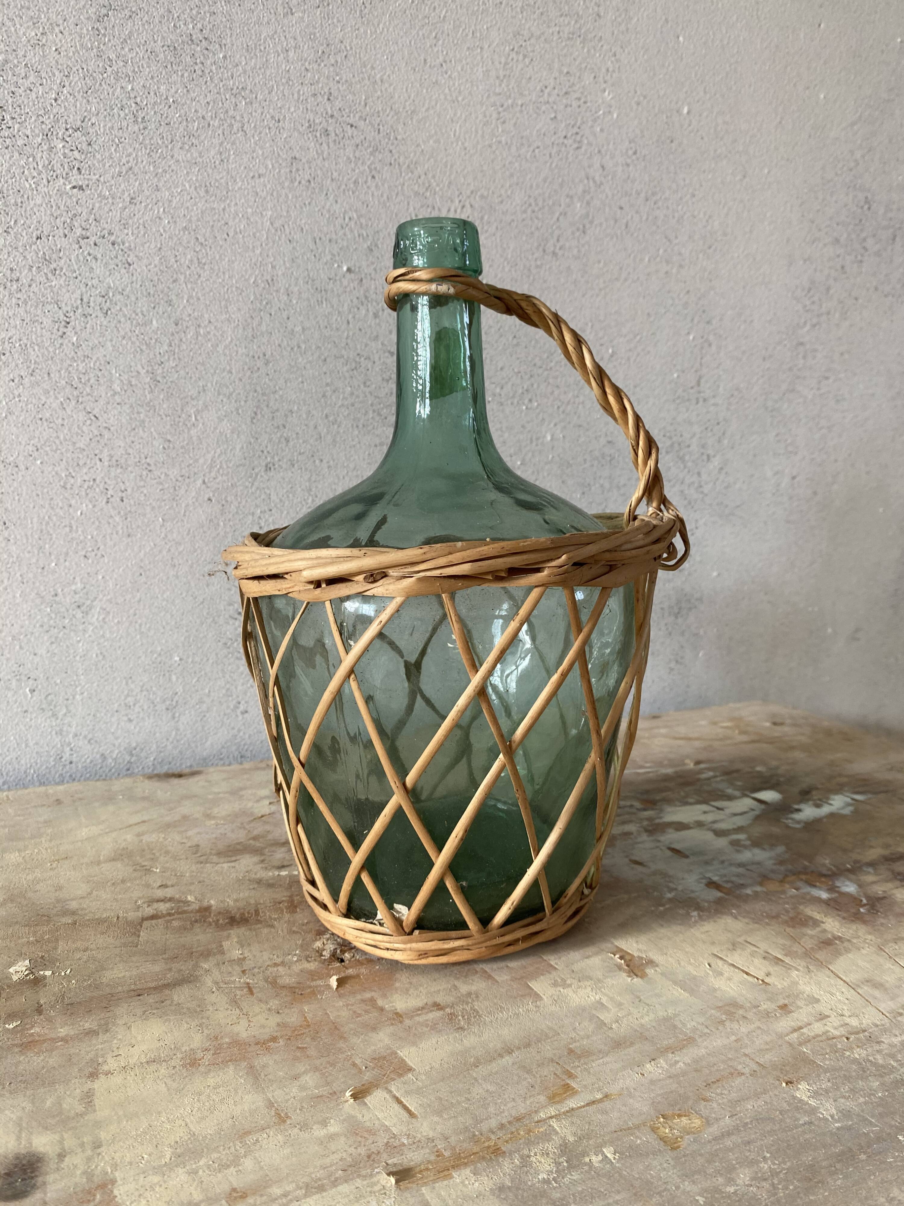 Bouteille dame Jeanne en verre bleu et osier