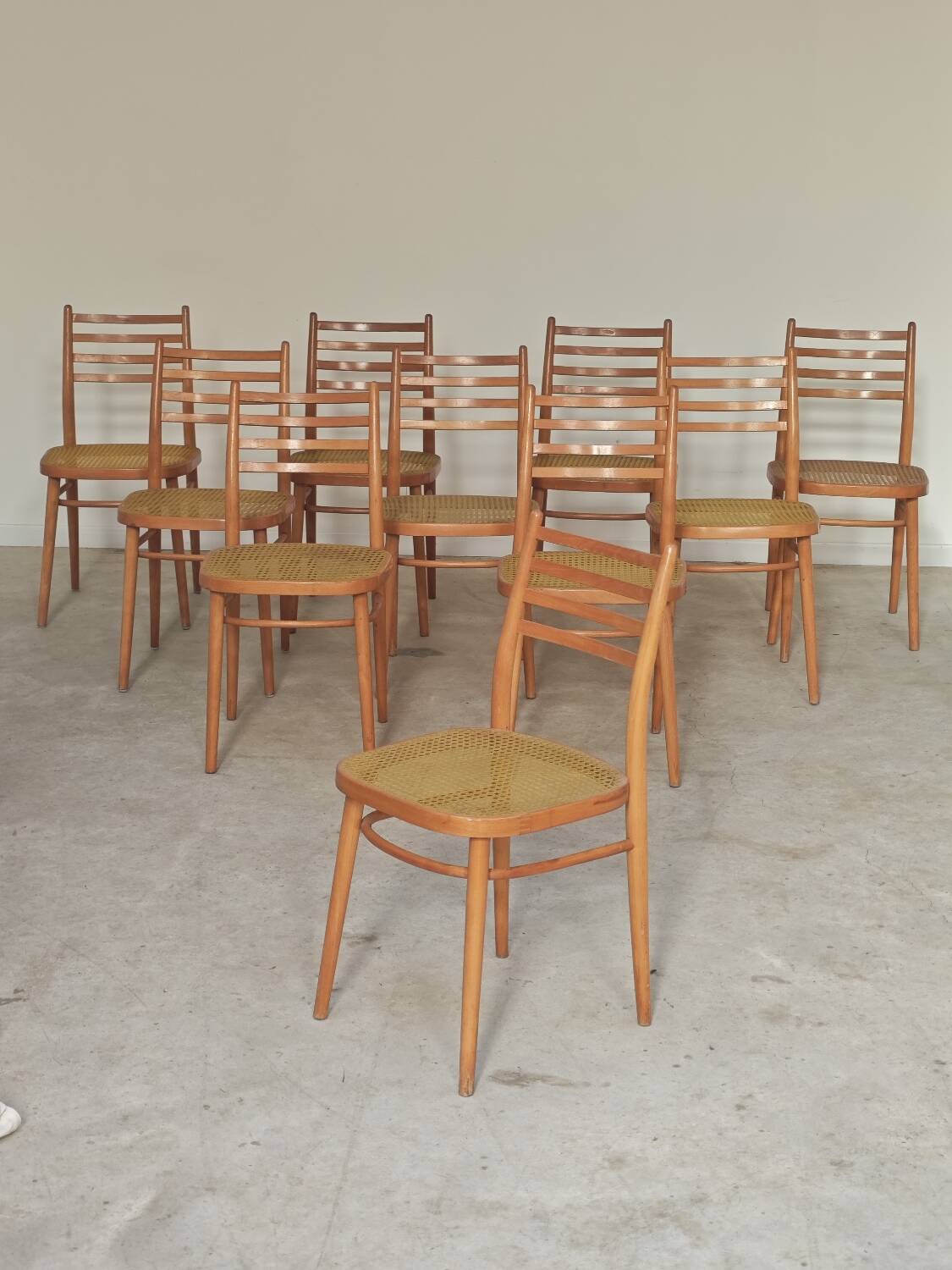 Set of 10 Bystrice tone wooden and caned chairs from the 1960s.