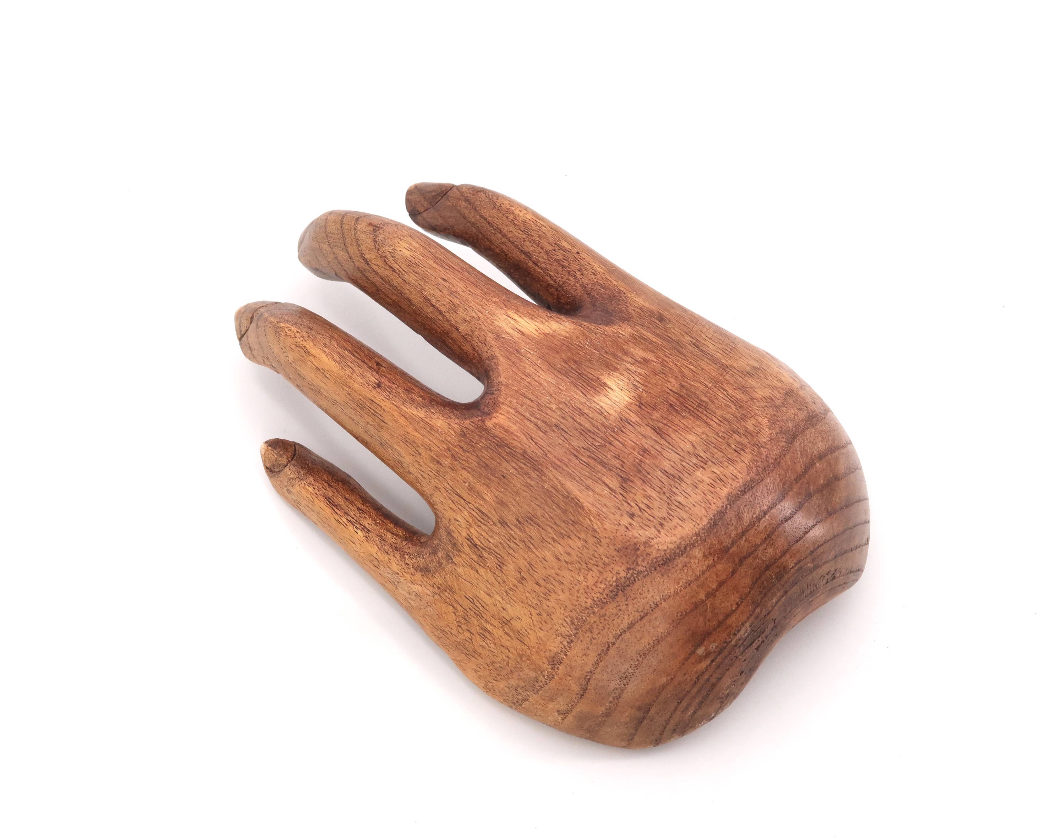Empty wooden pocket in the shape of a hand, vintage