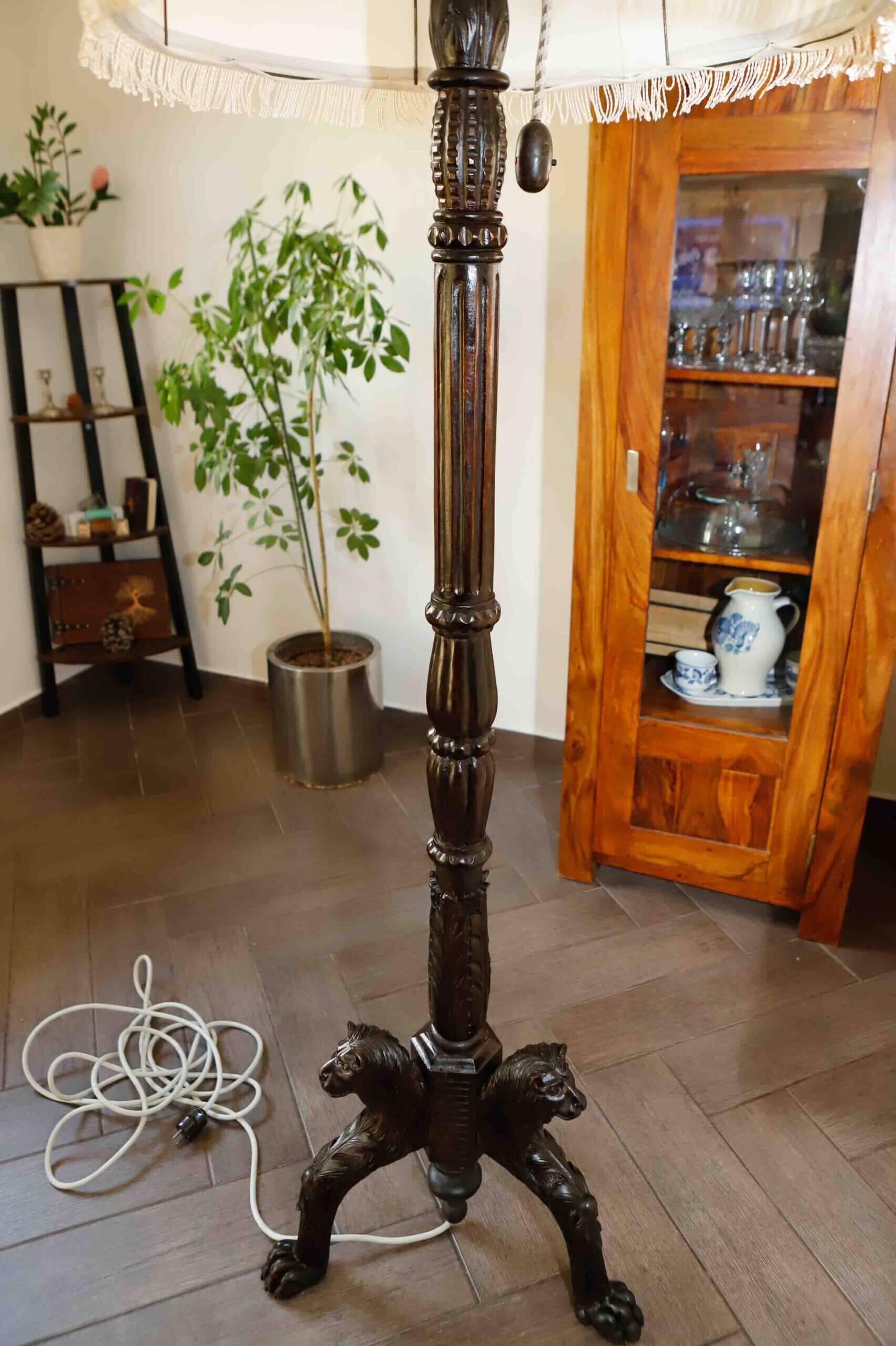 Antique floor lamp with lion motif