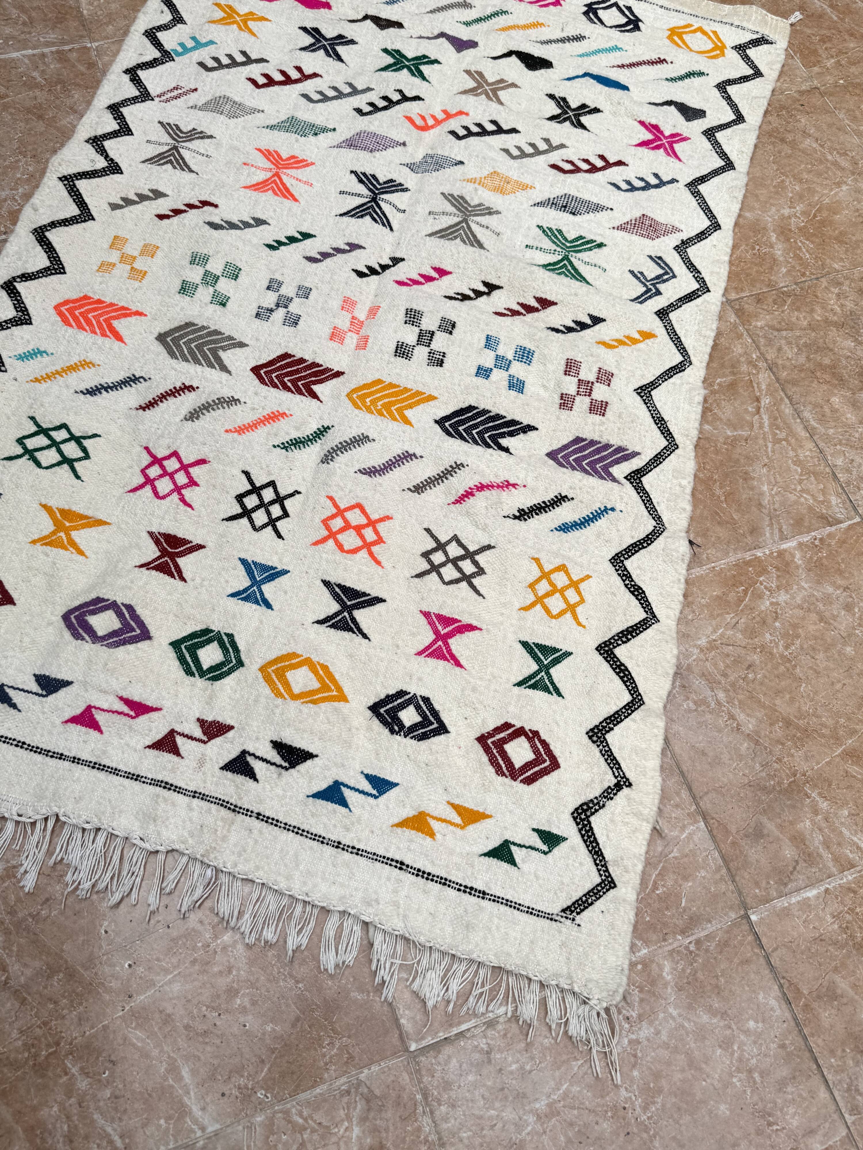 Handwoven Berber kilim rug: small Moroccan decorative rug.
