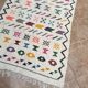 Handwoven Berber kilim rug: small Moroccan decorative rug.