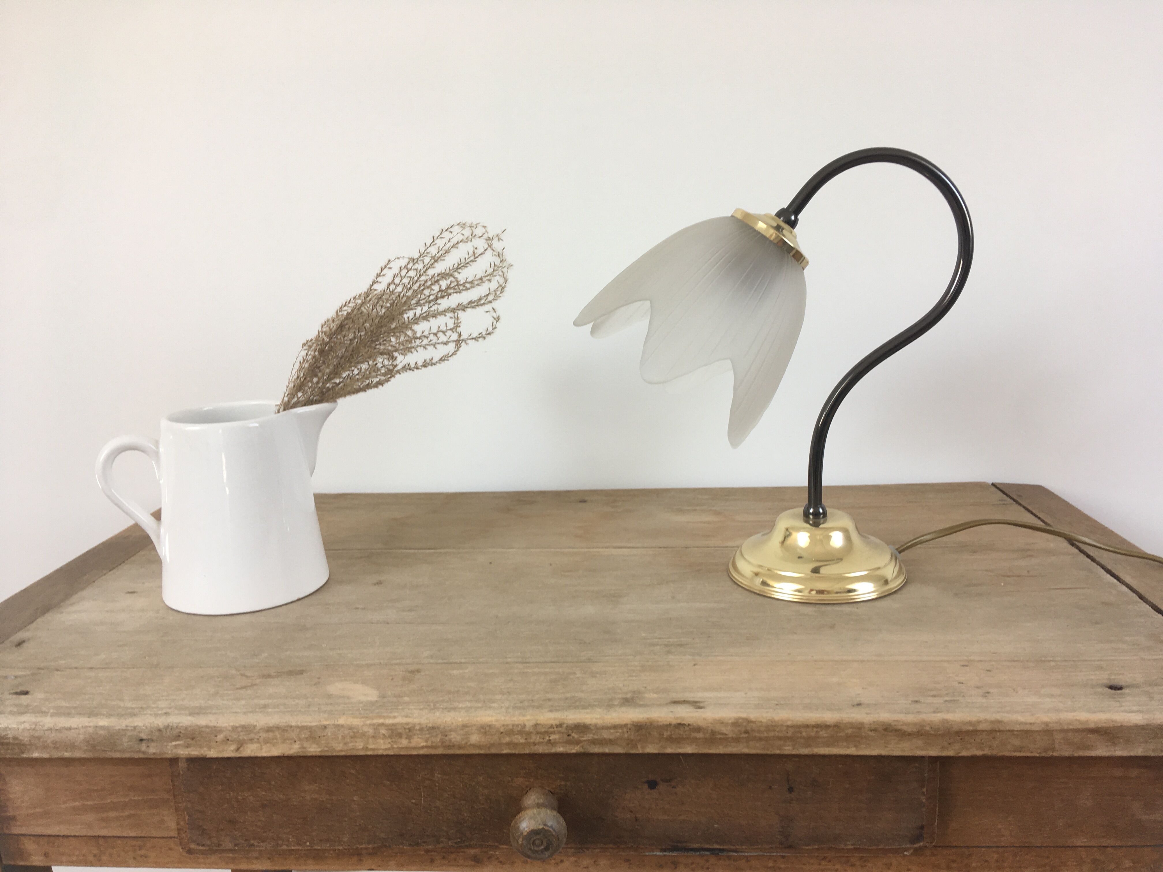 Table lamp with glass globe and brass foot
