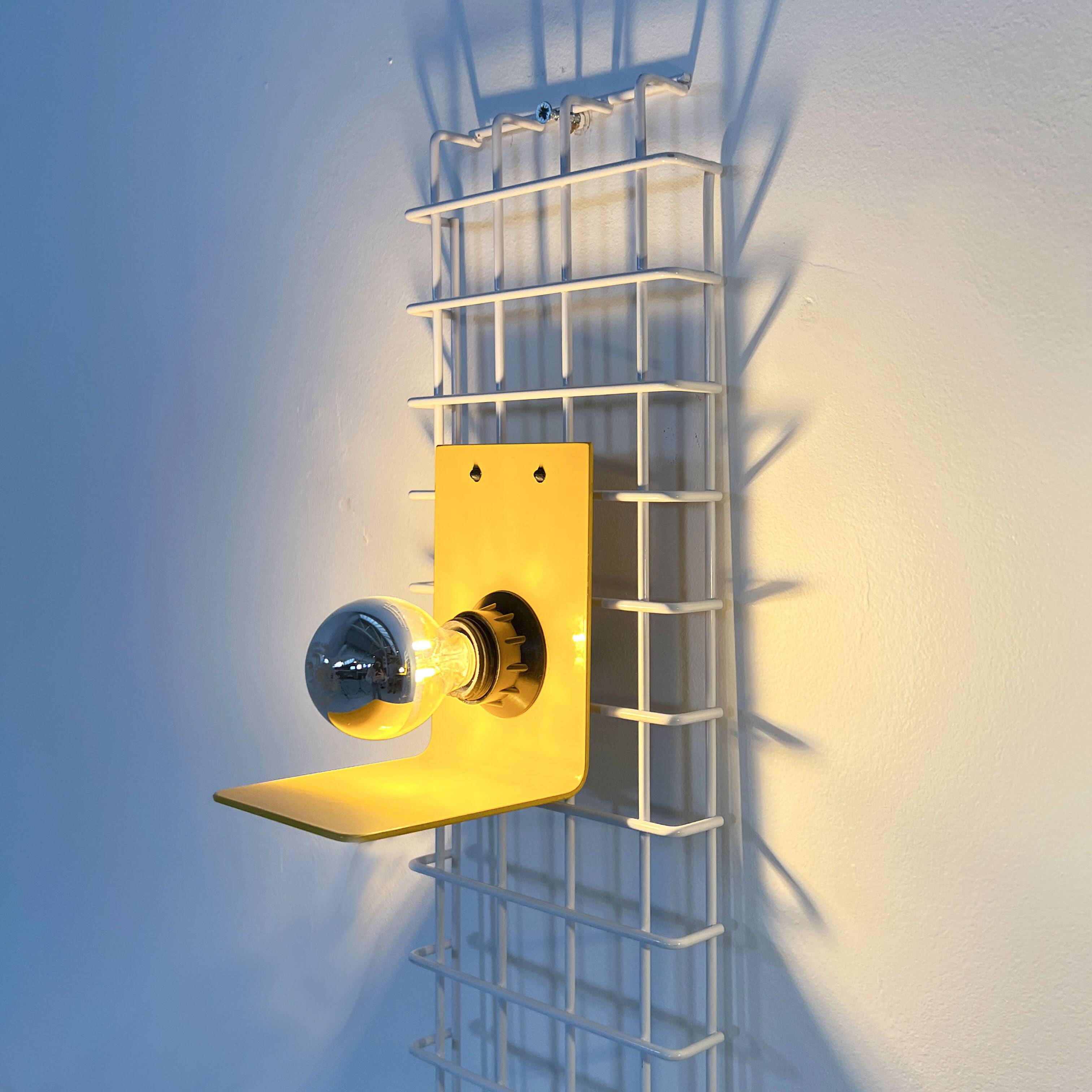 Pair of yellow wall sconces on wire mesh by Seccose, 1980