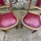 Pair of studded burgundy leather Art Deco chairs