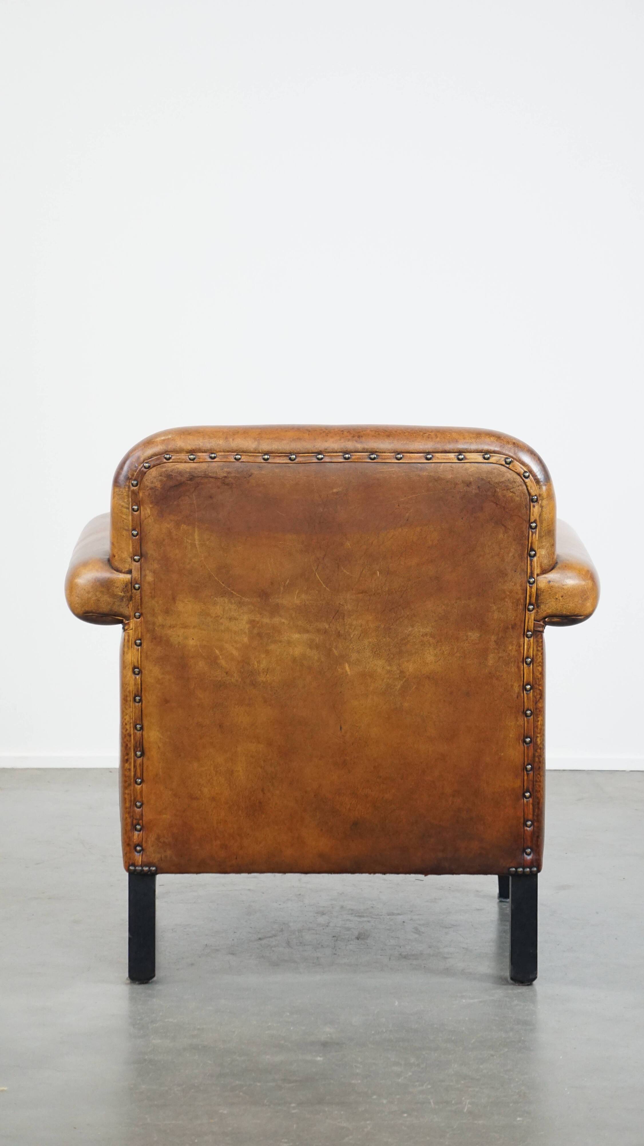 Sheep leather Art Deco design armchair finished with black piping