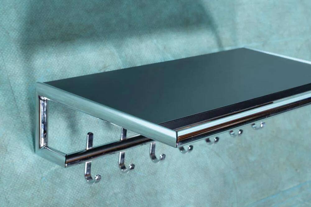 Minimalist coat rack, tubular chrome frame, 1980s Memphis style.