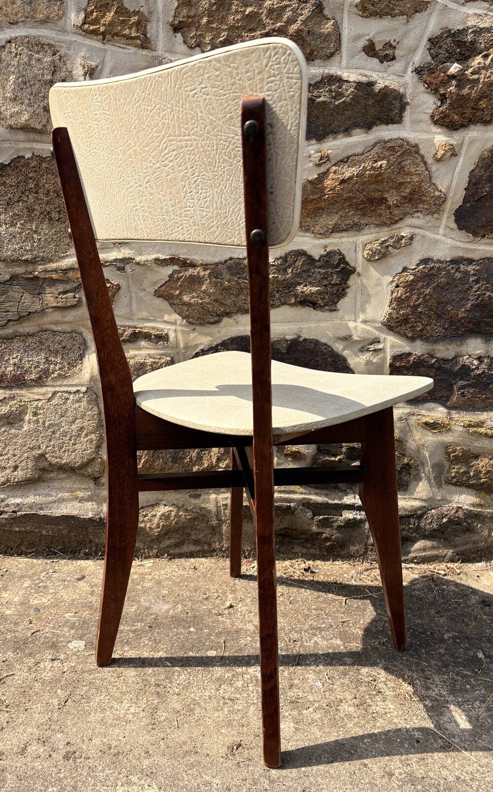 Pair of vintage chairs with upholstered backrest and seat, 1950s style.