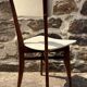 Pair of vintage chairs with upholstered backrest and seat, 1950s style.