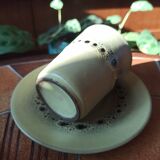 A pair of vintage glazed stoneware cups and saucers.