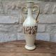 Antique amphora-shaped vase with Roman or Greek decoration