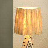 White and blue ceramic lamp, raffia shade