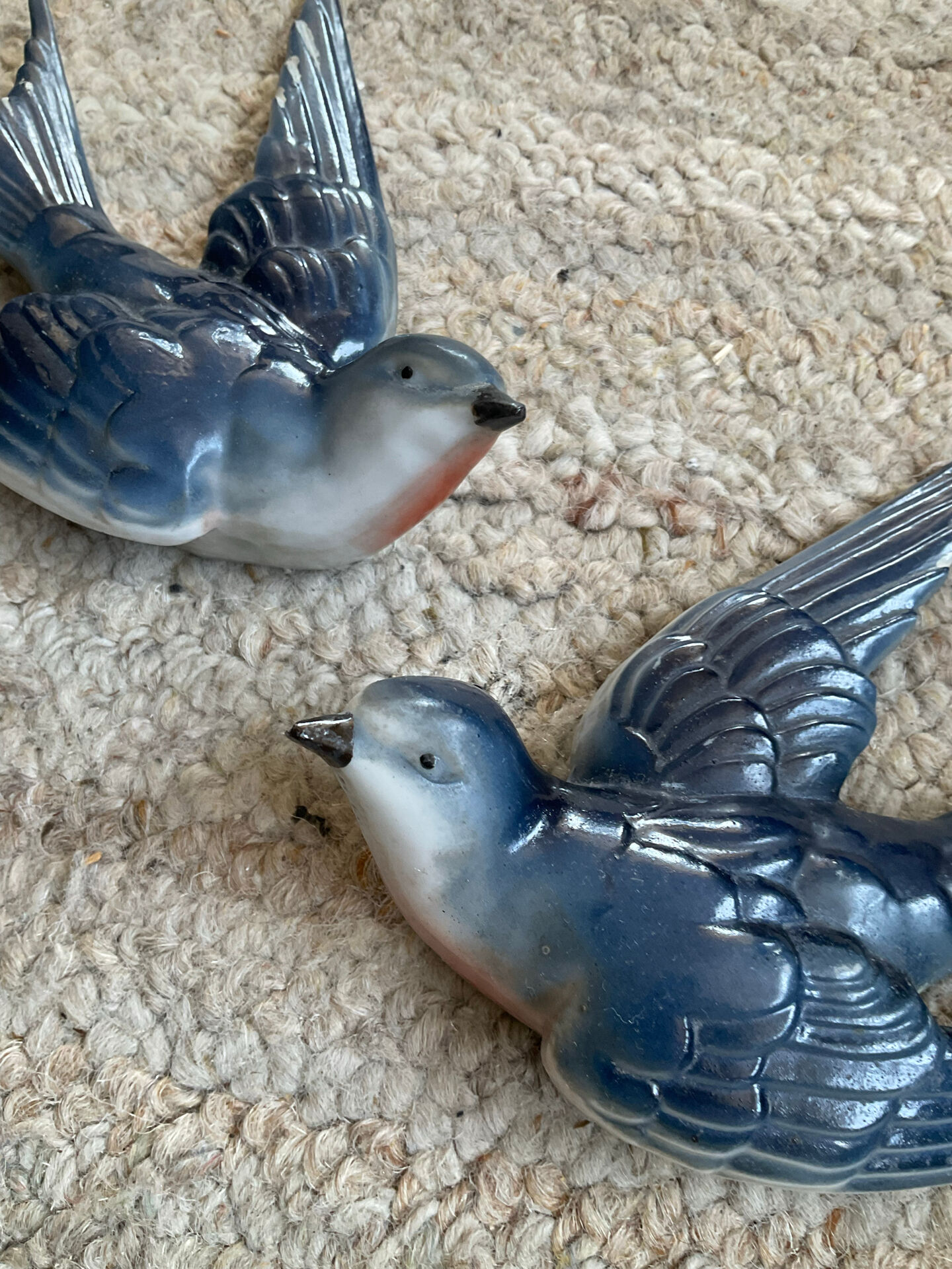 Old pair of porcelain birds for wall decoration.