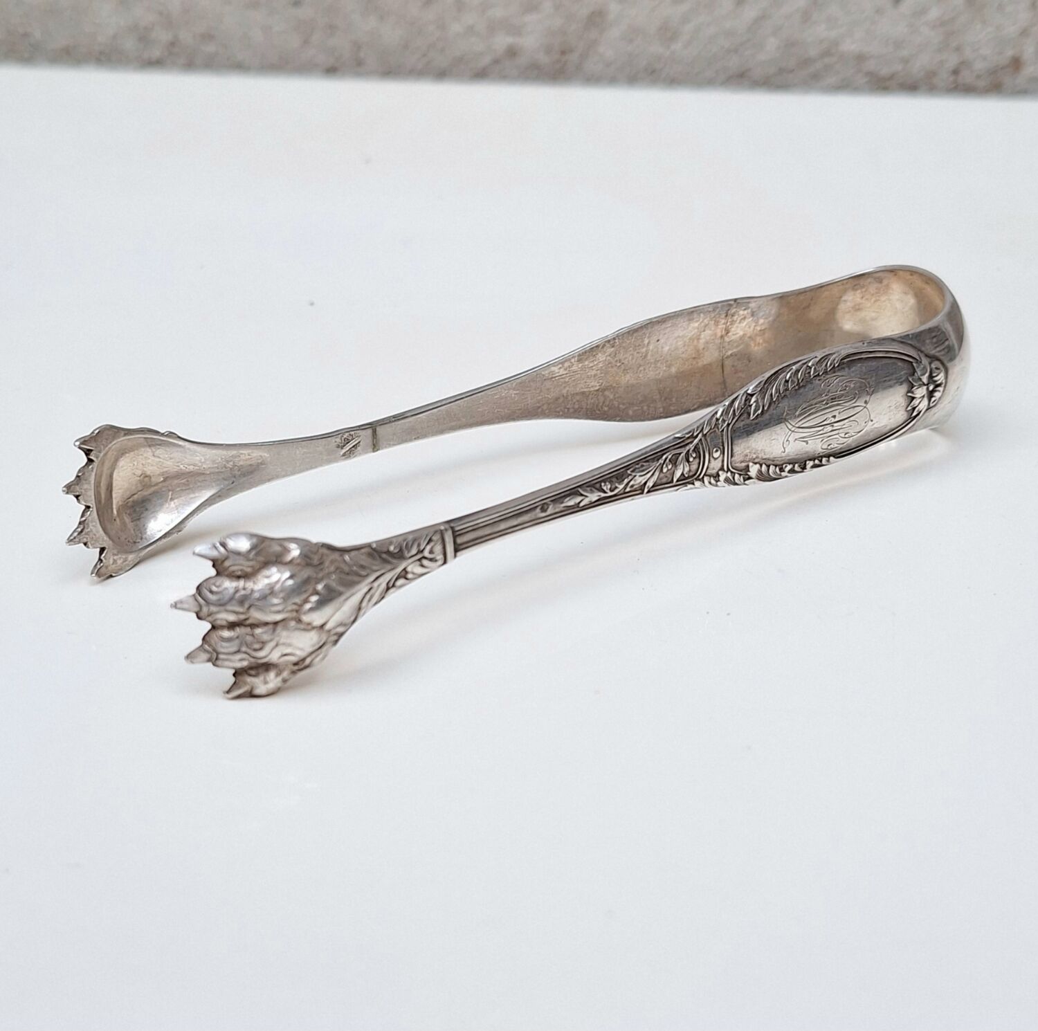 Solid silver sugar or ice tongs with lion's paw decoration
