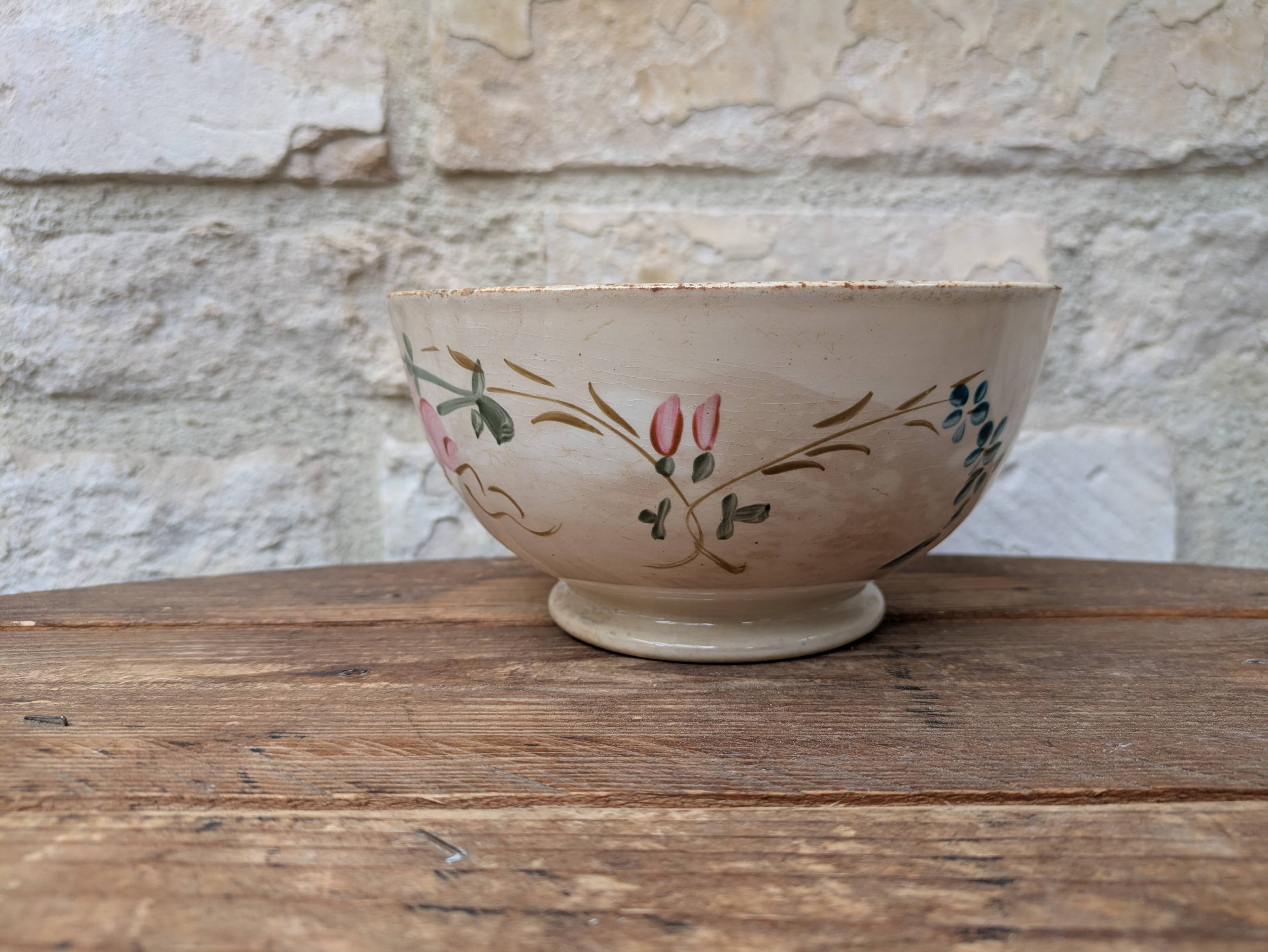 Old opaque porcelain bowl from Gien with a floral decoration.