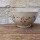 Old opaque porcelain bowl from Gien with a floral decoration.