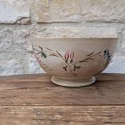 Old opaque porcelain bowl from Gien with a floral decoration.