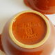 Duo of vintage Emile Henry cognac ear bowls