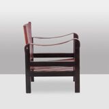 “Safari” armchair in wood and cognac leather. 1960s/70s.