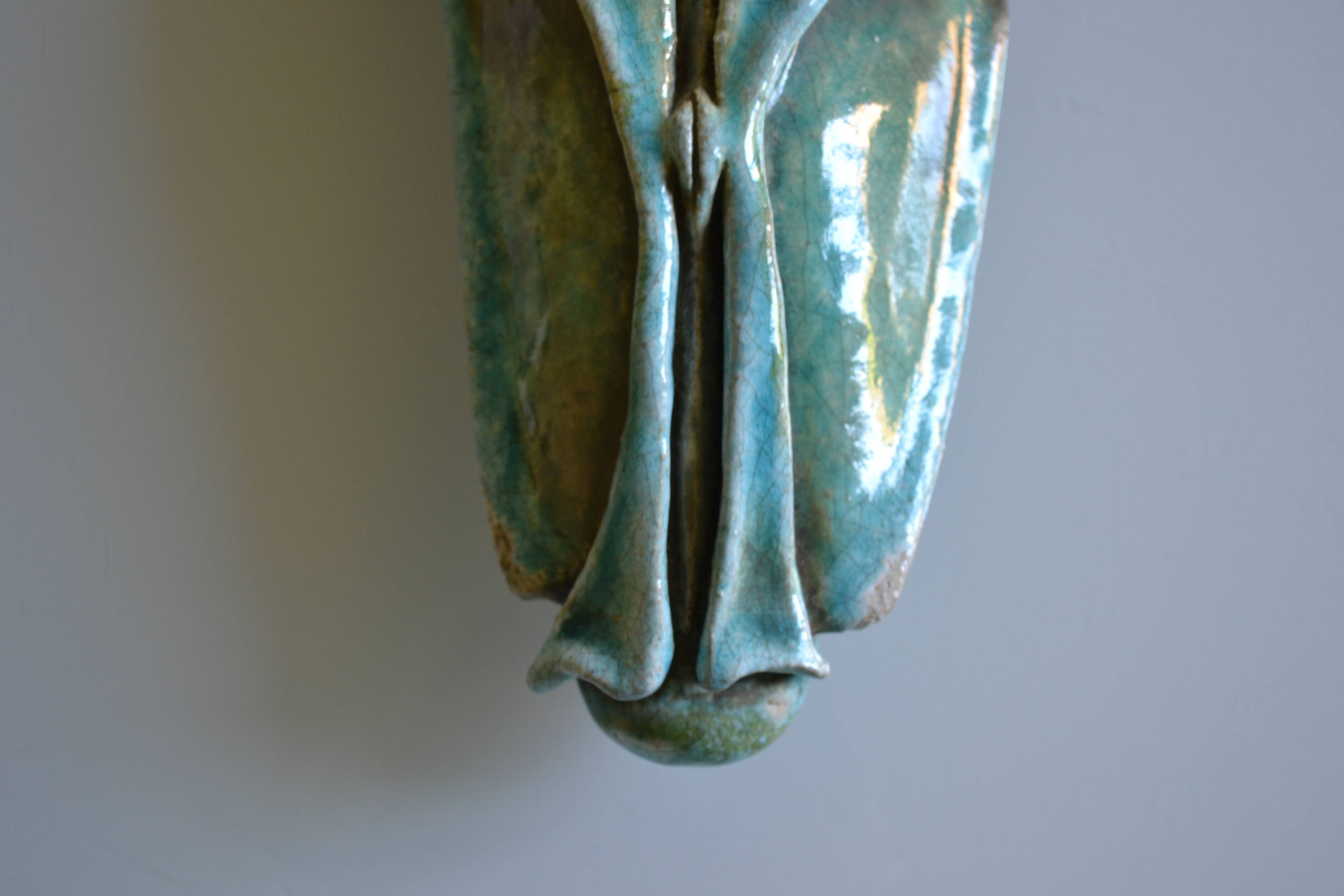 Surreal ceramic sculpture in relief signed to be identified.