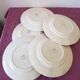 Set of 5 flat plates, signed Longwy.