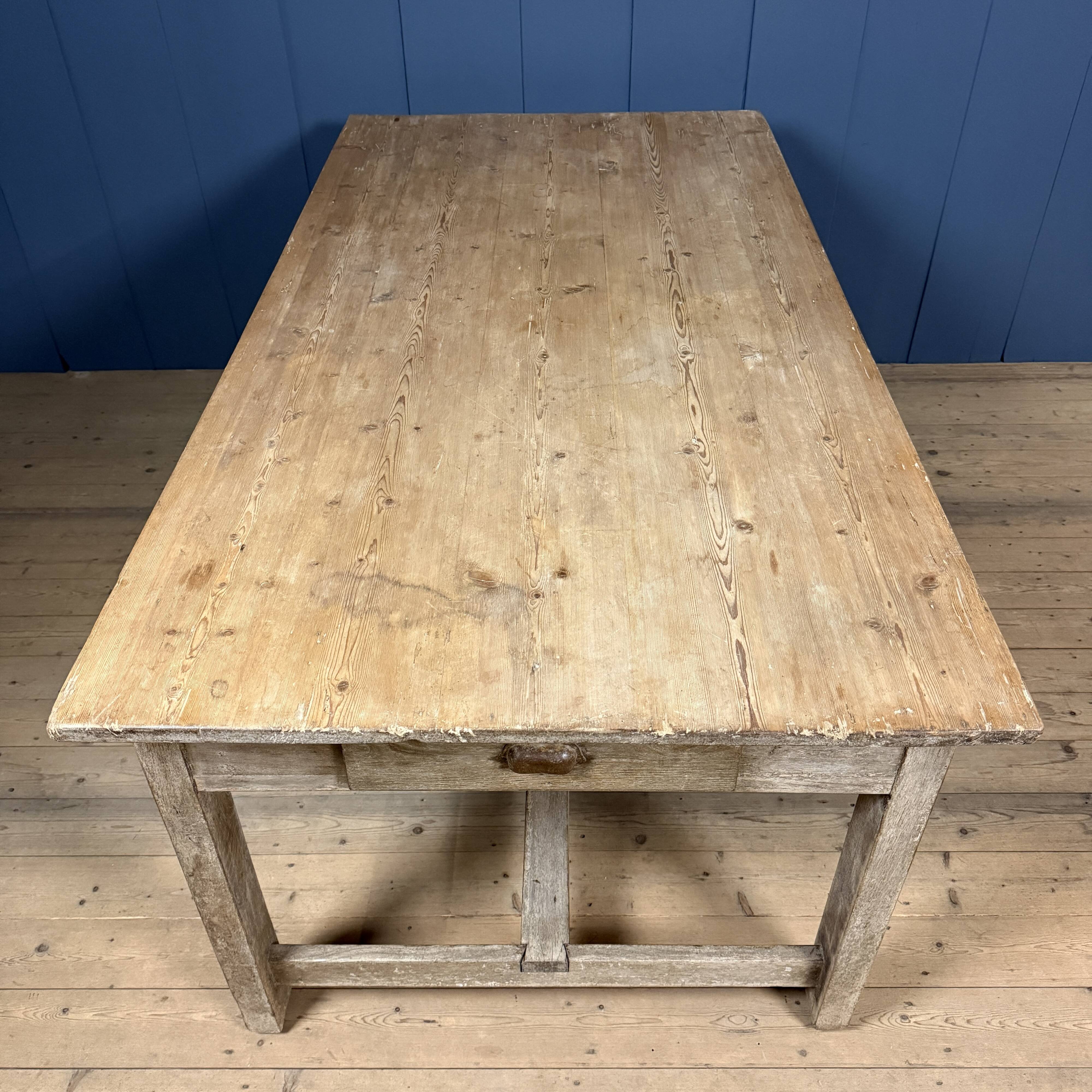 French farmhouse dining table with pine top and oak base