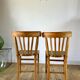 Pair of bistro chairs in light curved wood and green seat 1950s