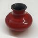 Red ceramic ball vase signed A