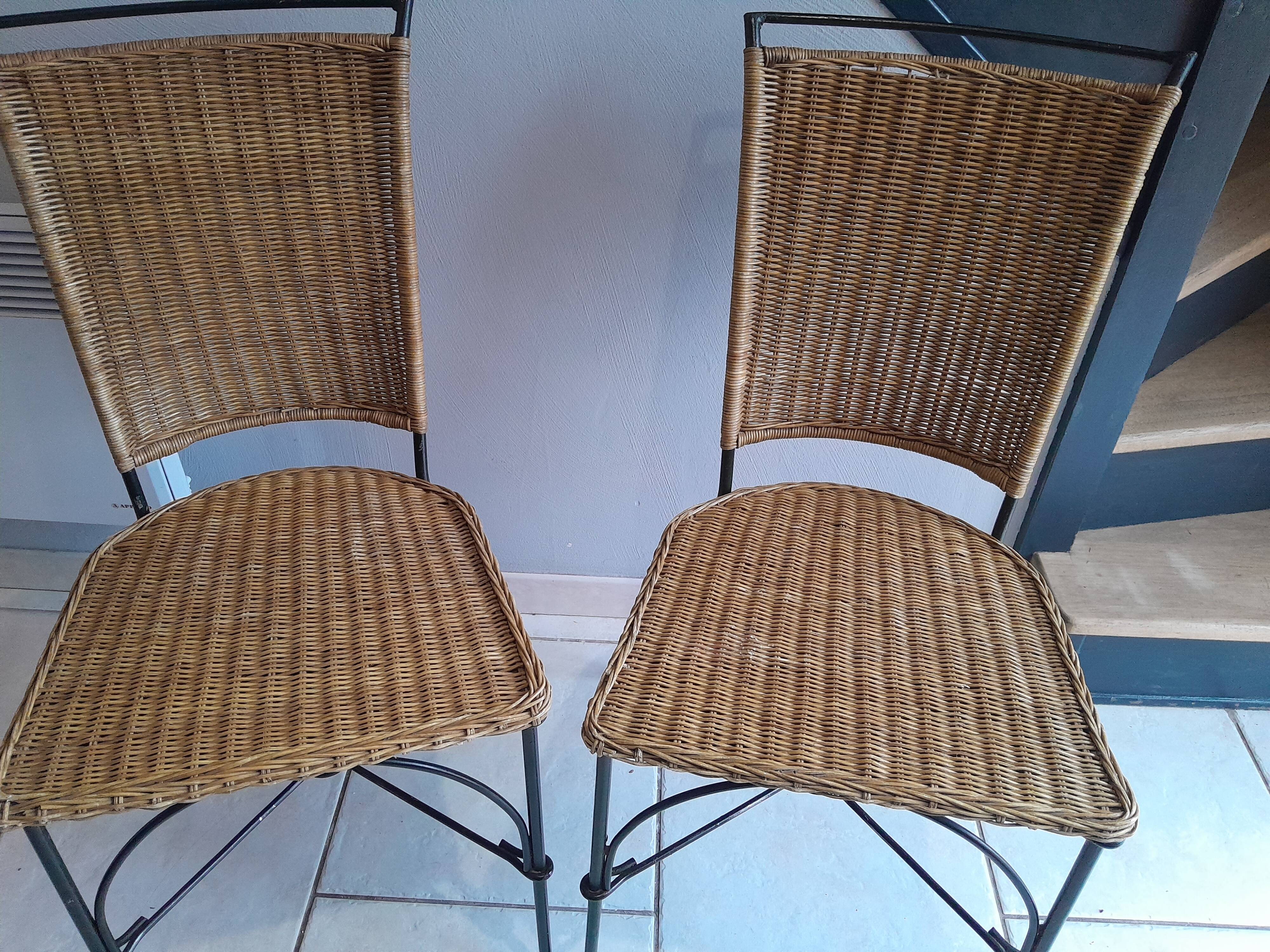 Pair of vintage wrought iron and rattan chairs