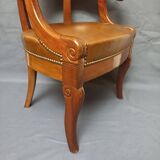 Fauteuil de bureau garni de cuir début XIXe siècle,