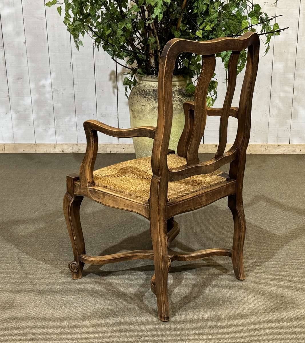 20th-century armchair in beech with a straw seat in Louis XV style.