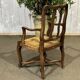 20th-century armchair in beech with a straw seat in Louis XV style.