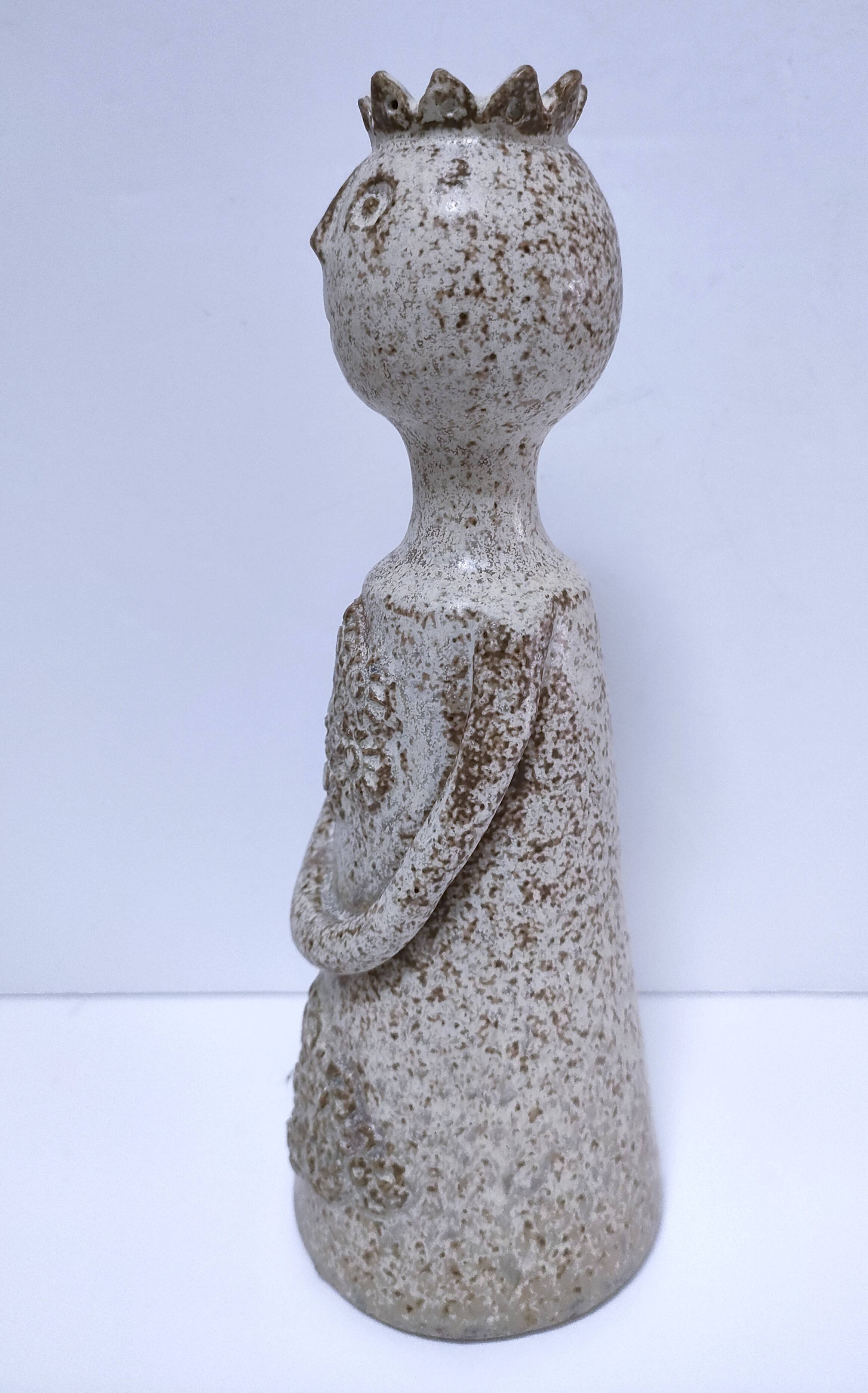 ceramic candle holder with crowned head signed P