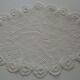 Oval white placemat in crocheted cotton