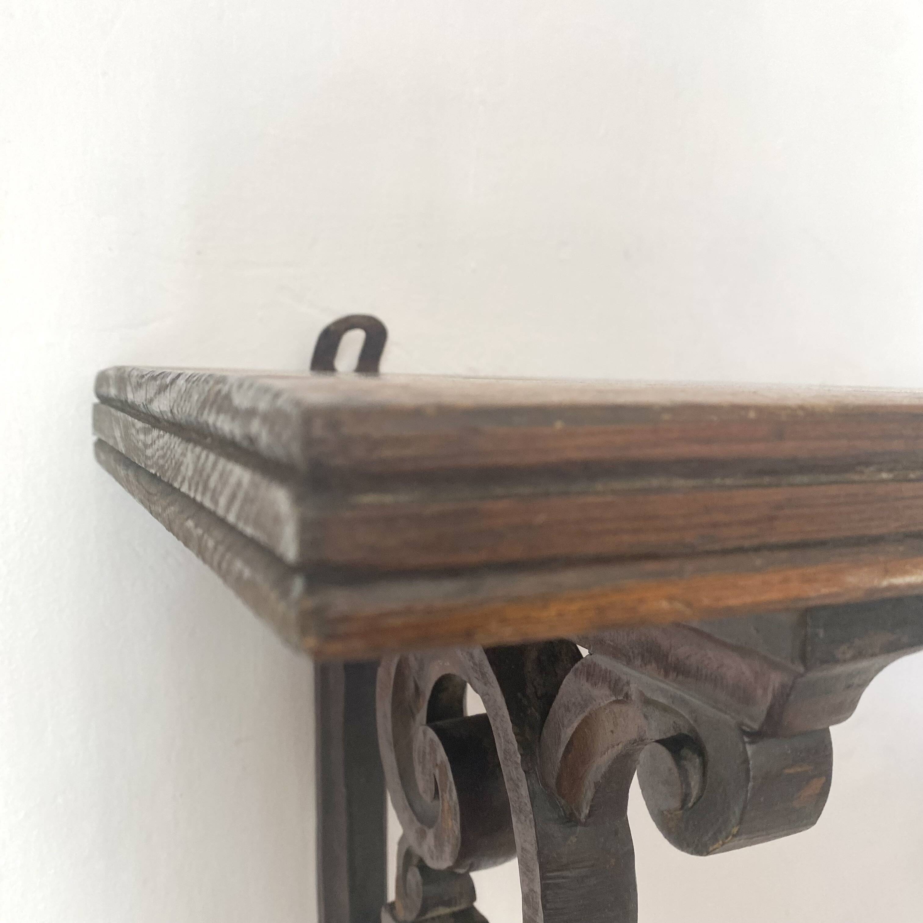 antique oak wall shelf with carved brackets