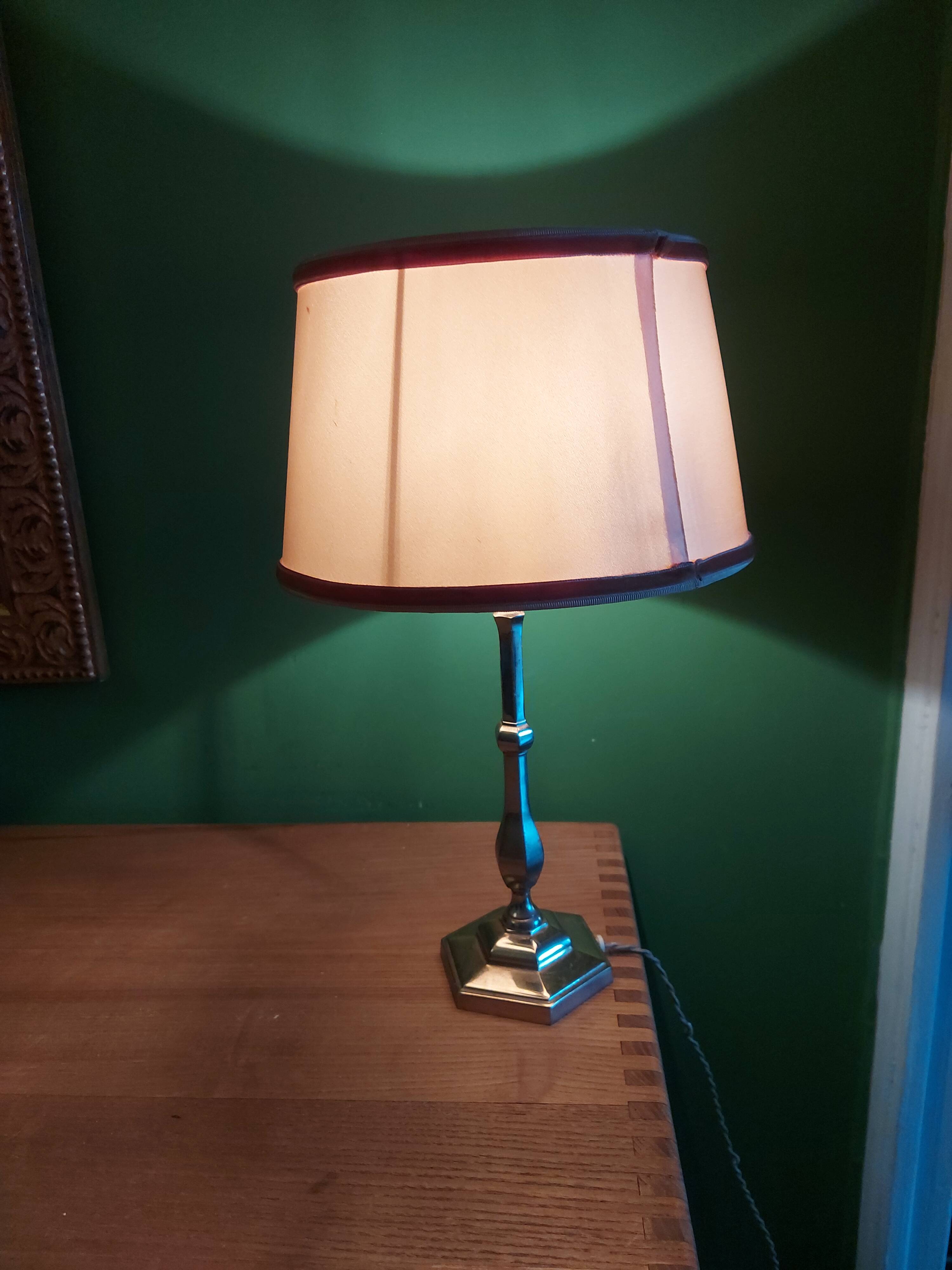 Silver metal lamp with its lampshade