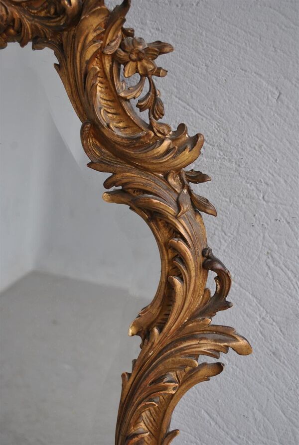 Miroir en stuc doré rocaille époque XIXème 110cm