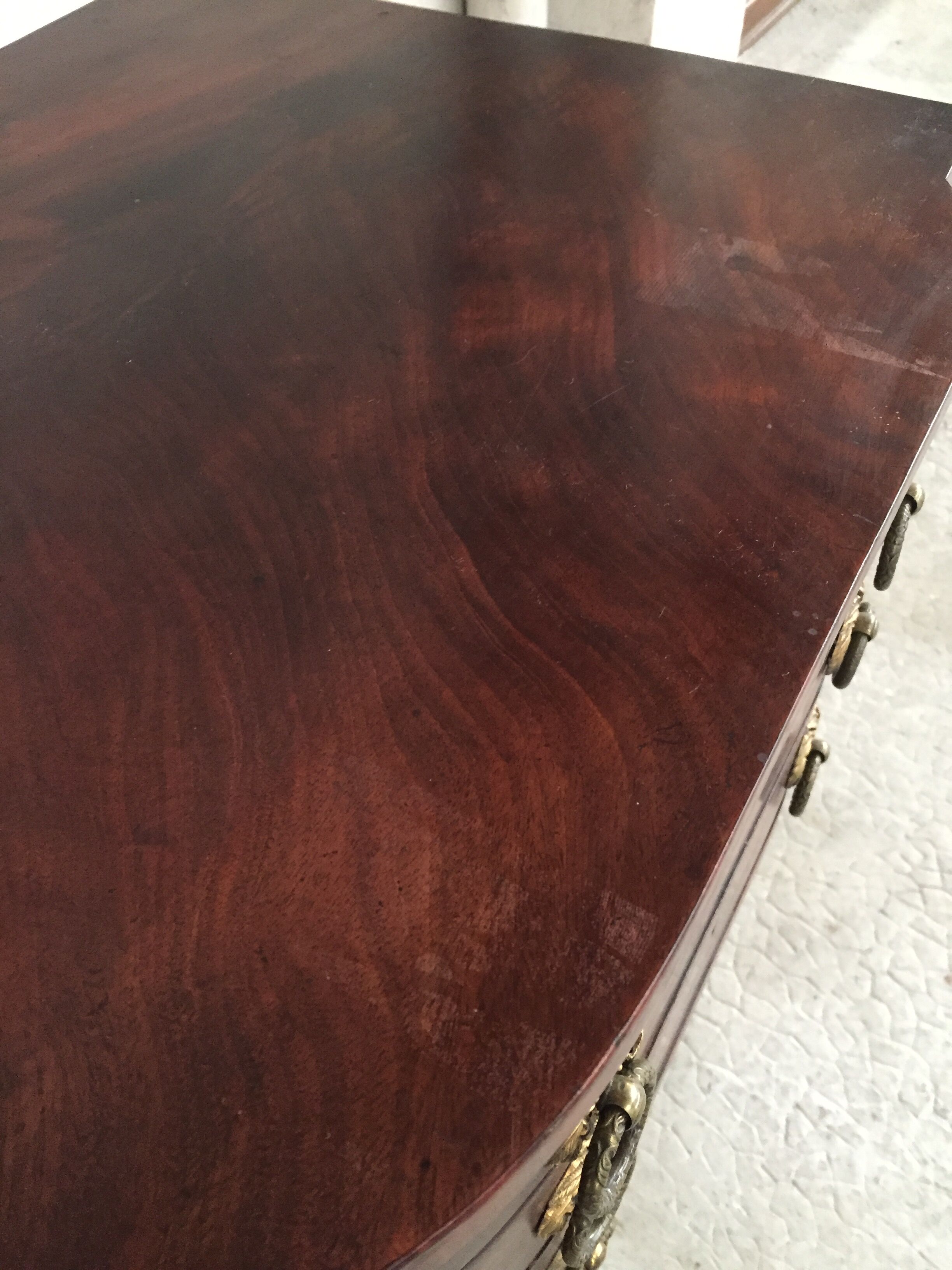 Small piece of english furniture has 3 drawers in mahogany for silverware