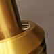 Hanging lamp in gold-colored aluminum with many layers of shades.