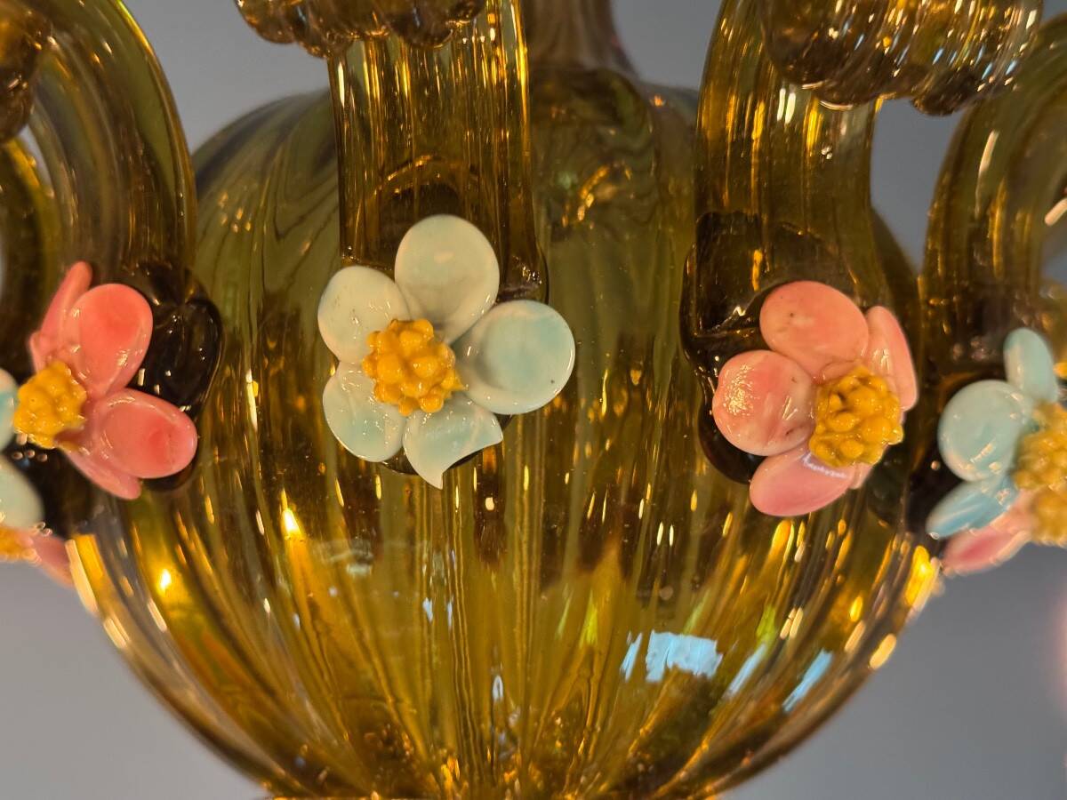 Venetian chandelier in multi-colored Murano glass with a green dominant color, 12 light arms, circa 1880