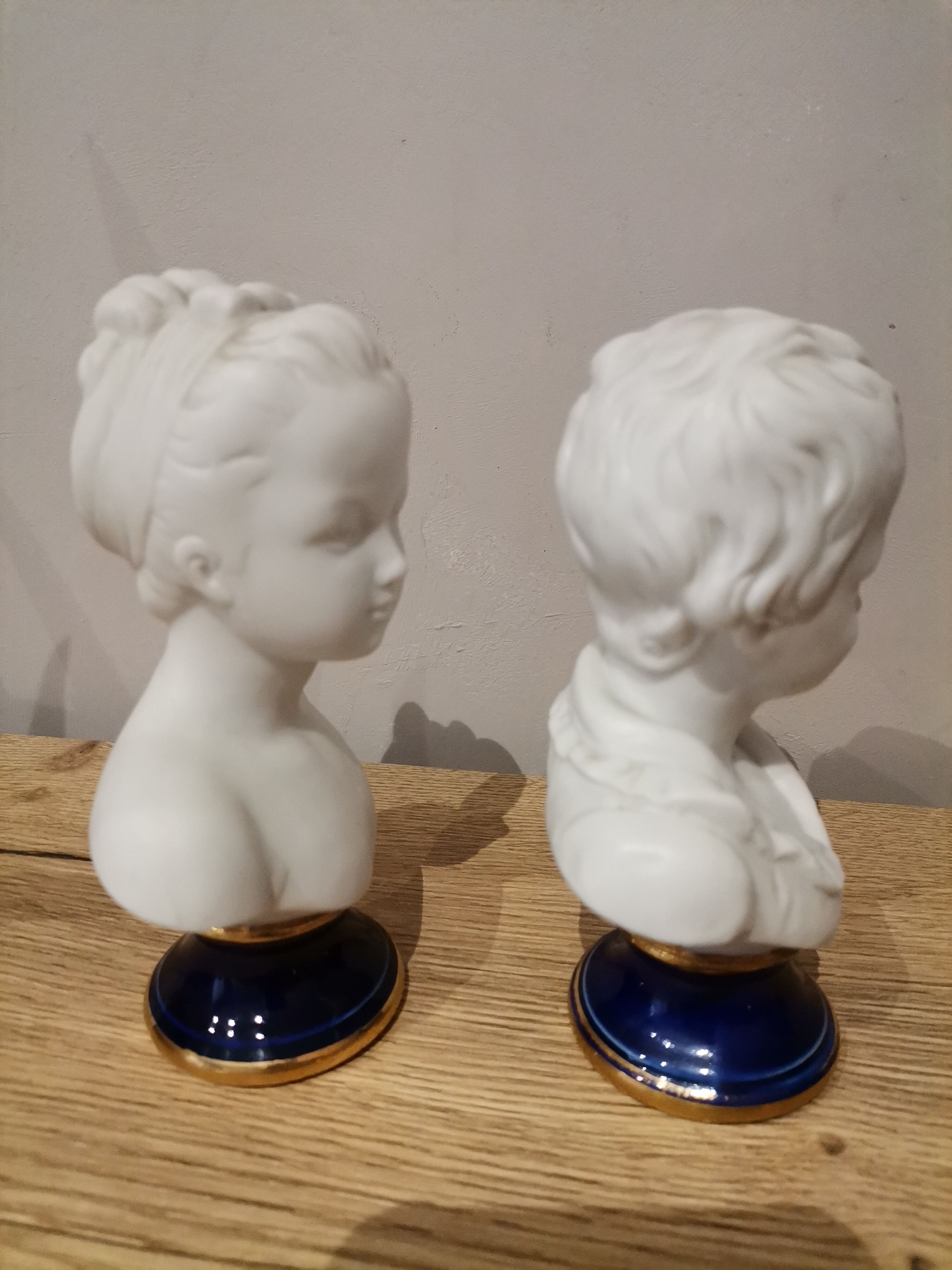 Signed children's busts