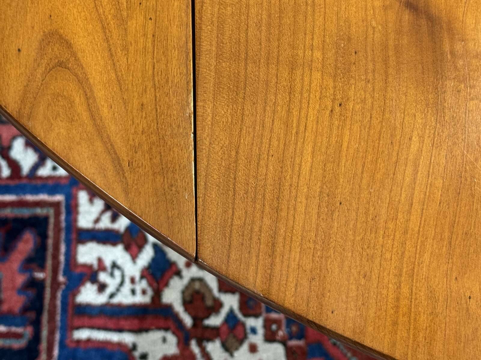 Round cherry wood table, 6 feet, Louis Philippe style with 2 extensions.